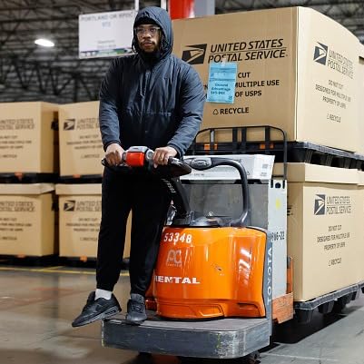 U.S. postal carriers hard at work on remaining Christmas deliveries by Unknown